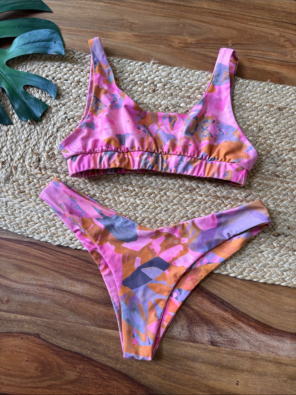 Kulani Kini’s vibrant pink and orange print top and Bikini Bottoms